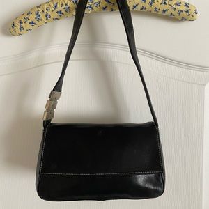 Perlina Purse. Leather. Black. Over the Shoulder.  Approx. 5” x 9”